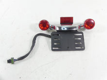 Load image into Gallery viewer, 2016 Harley Touring FLTRX Road Glide Rear Blinker Bar Plate Holder Set 73309-10