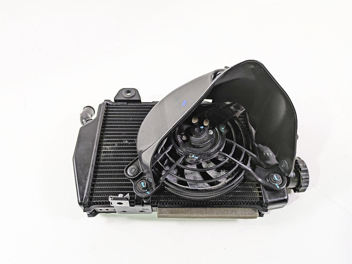 Used motorcycle radiator and cooling fan assembly on white background, available at Mototech271