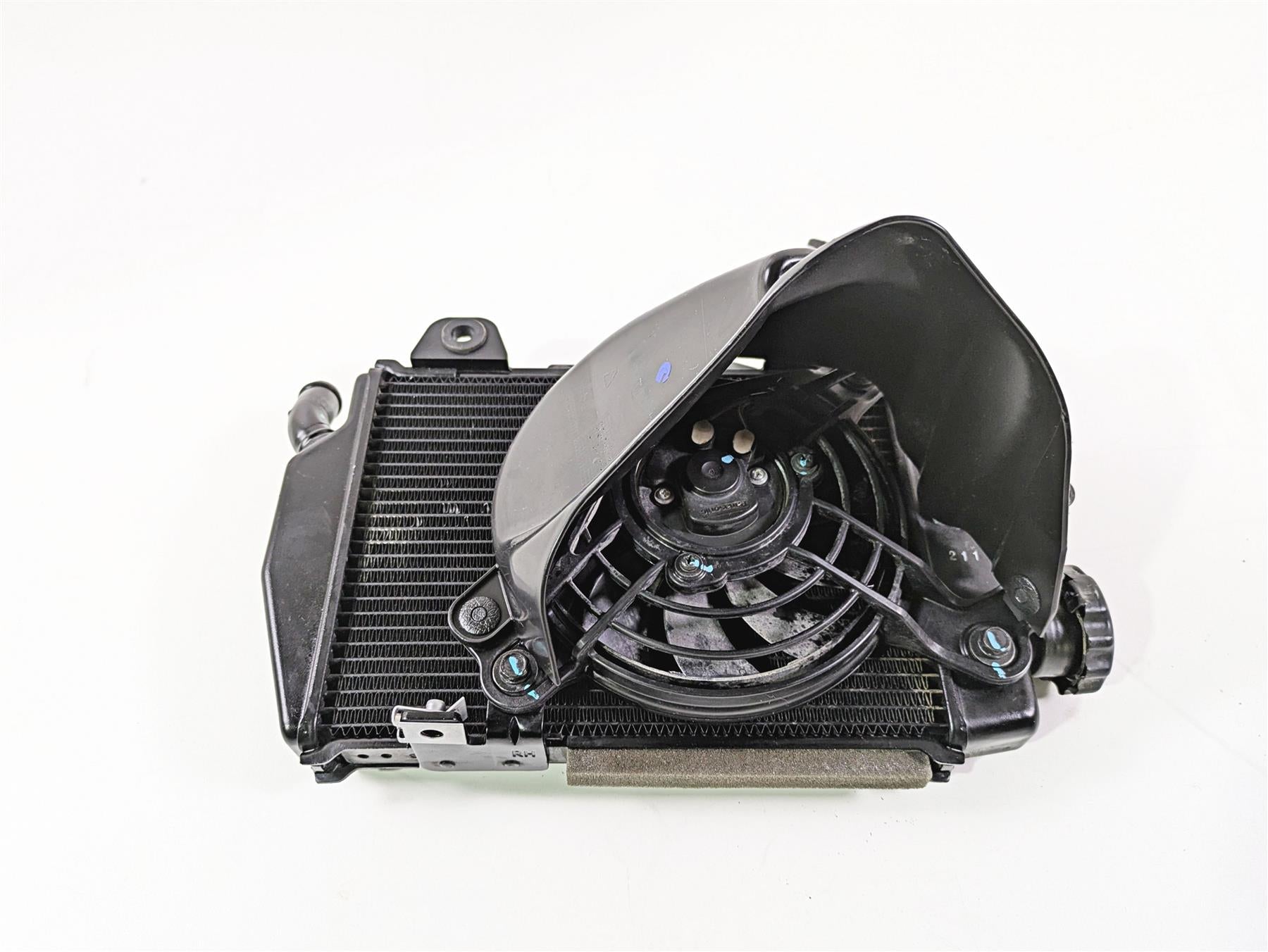 Used motorcycle radiator and cooling fan assembly on white background, available at Mototech271