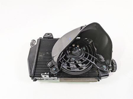 Used motorcycle radiator and cooling fan assembly on white background, available at Mototech271