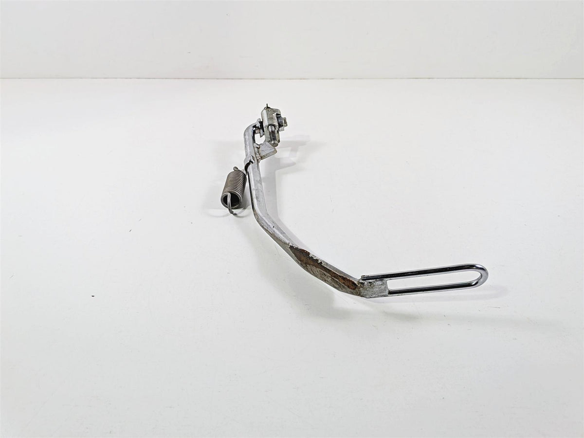 Used chrome motorcycle brake pedal with spring on white background, available at Mototech271
