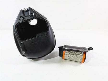 Used motorcycle airbox and air filter on white background, available at Mototech271