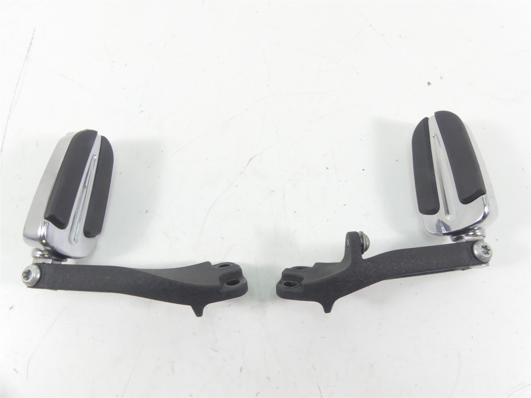 Pair of used motorcycle foot pegs with black rubber and chrome finish, available at Mototech271