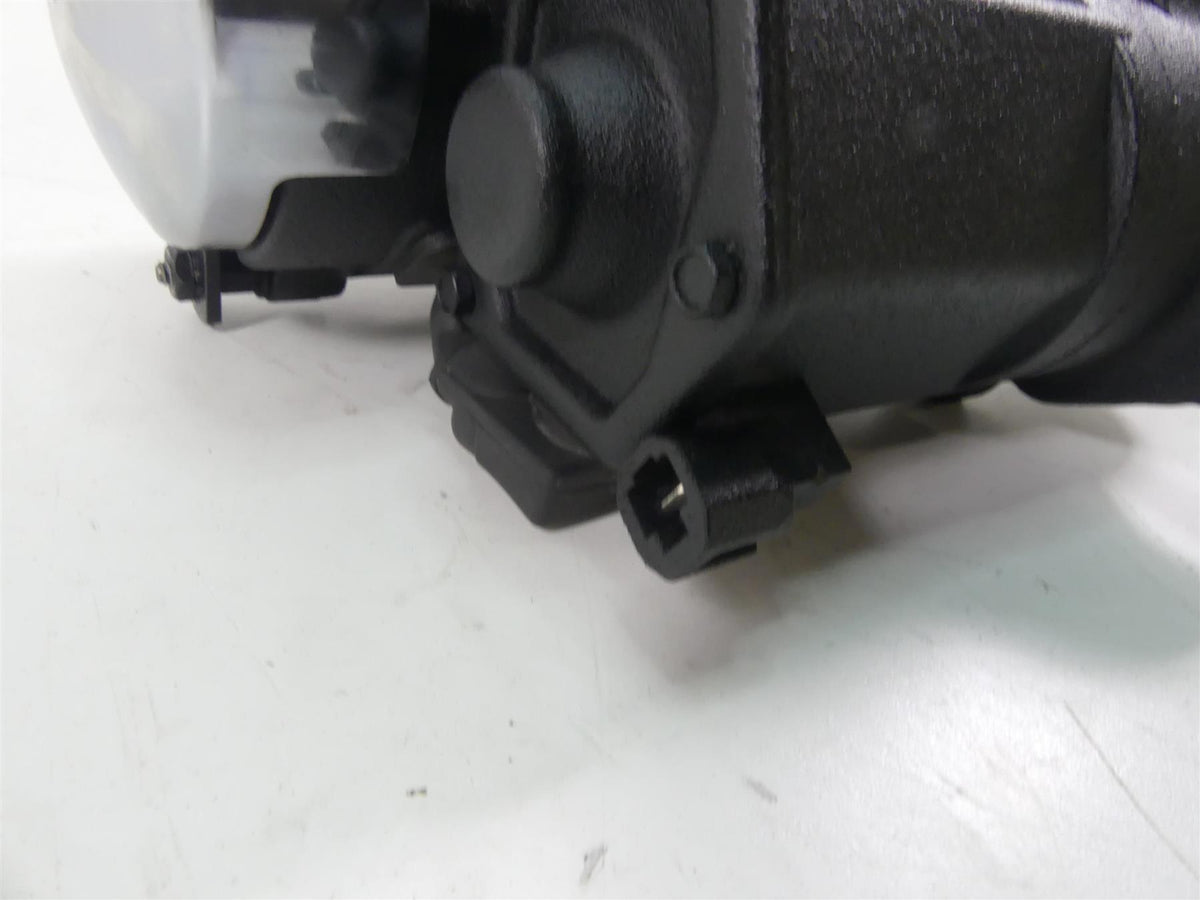 Close-up of used black motorcycle part with connector plug, available at Mototech271