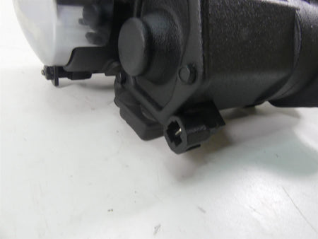 Close-up of used black motorcycle part with connector plug, available at Mototech271