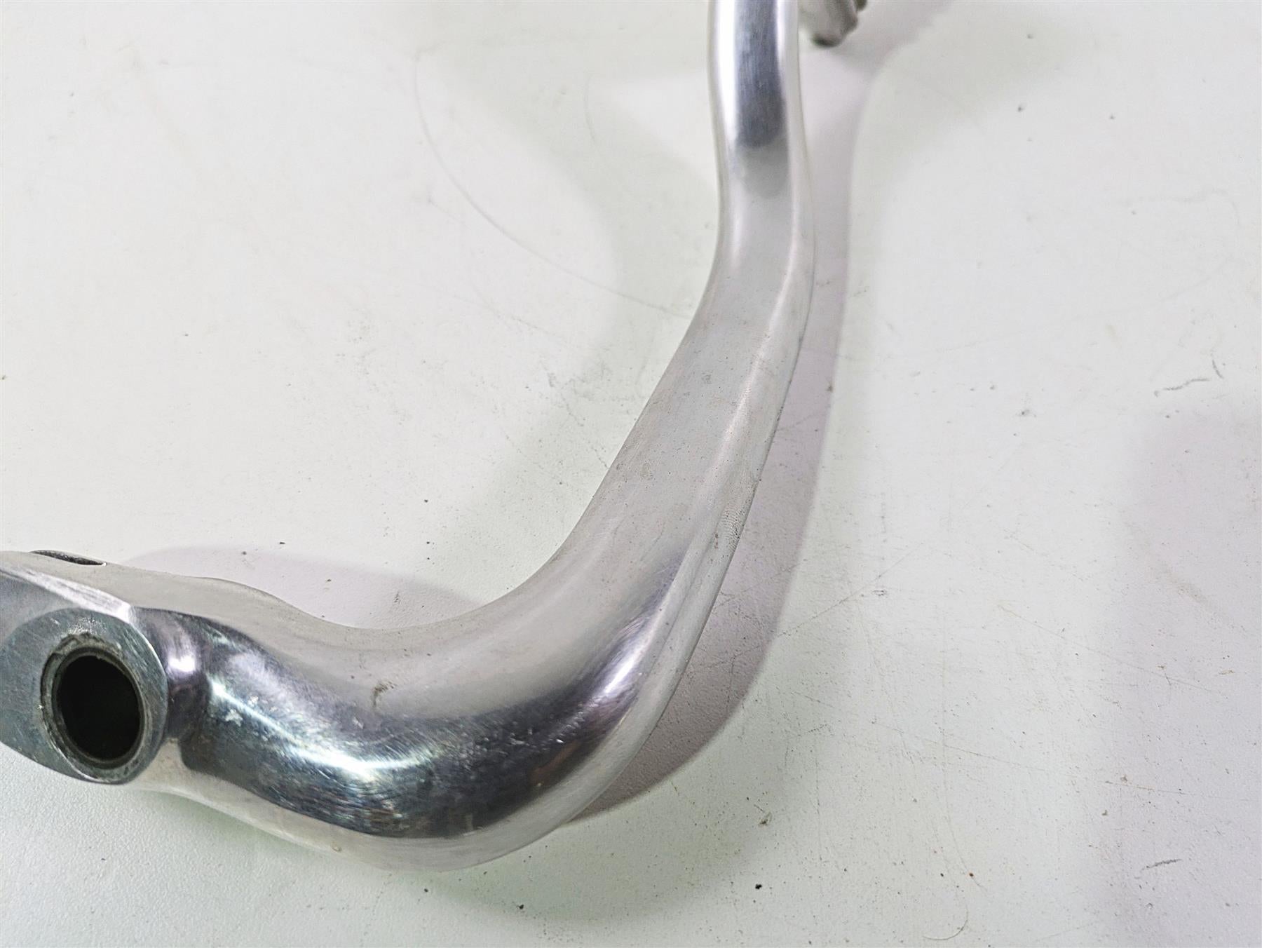 Used motorcycle aluminum handlebar part, close-up on white background, available at Mototech271