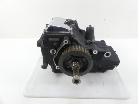 Used motorcycle engine gearbox with visible gears and shaft on white background, available at Mototech271