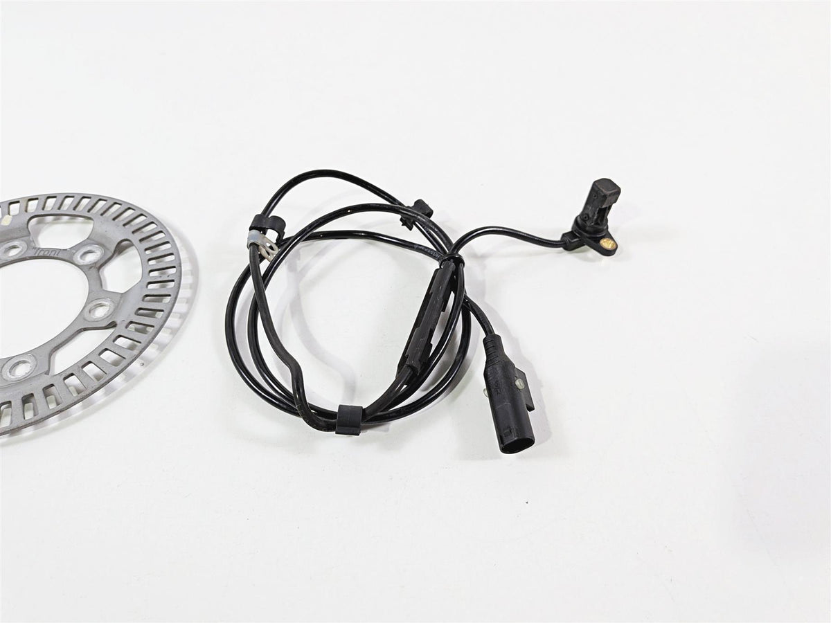 Used motorcycle ABS sensor cable and brake rotor on white background, available at Mototech271