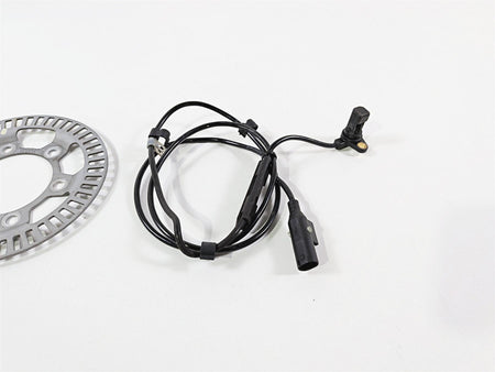 Used motorcycle ABS sensor cable and brake rotor on white background, available at Mototech271