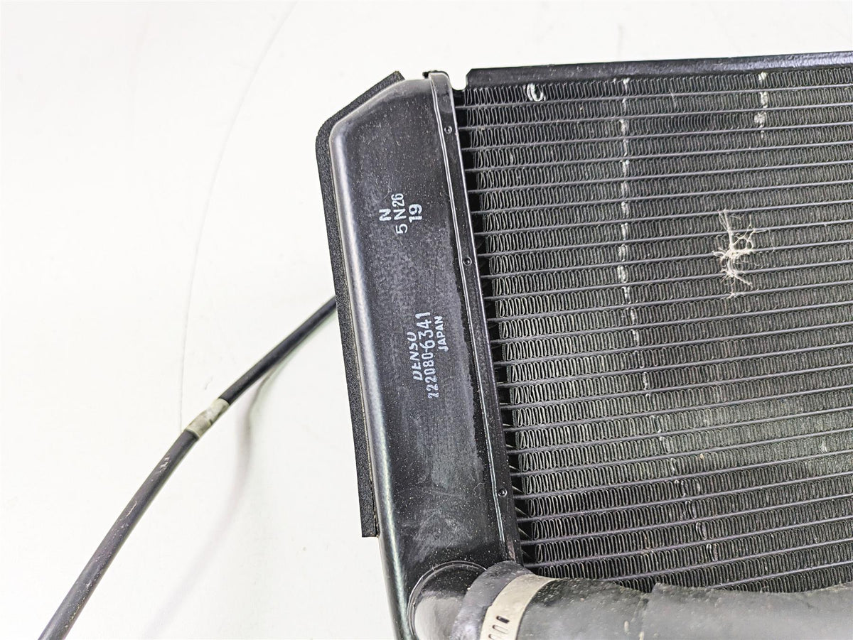 Used motorcycle radiator with cooling fins and attached hose available at Mototech271