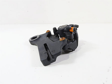 Used black motorcycle brake caliper part on white background, available at Mototech271