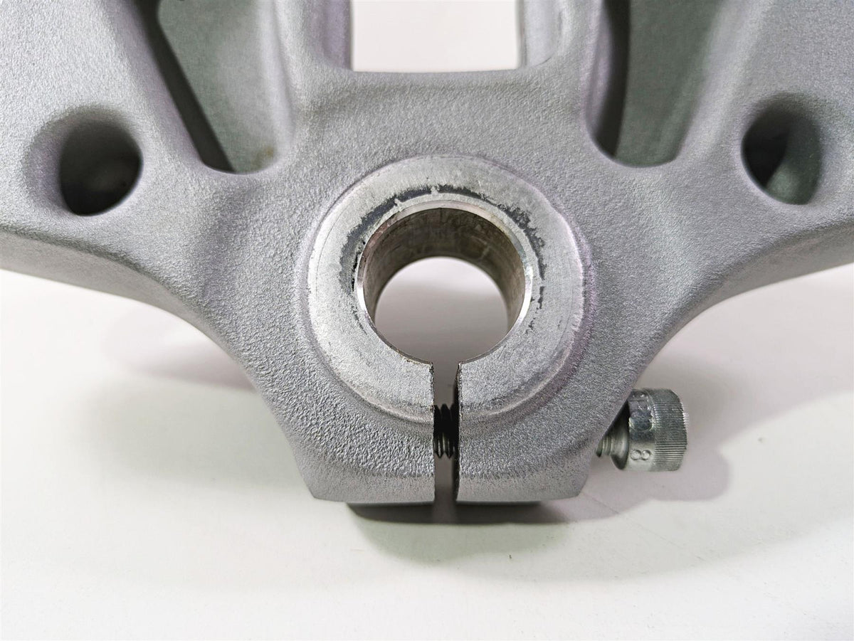 Close-up of a used silver motorcycle triple tree clamp part, available at Mototech271
