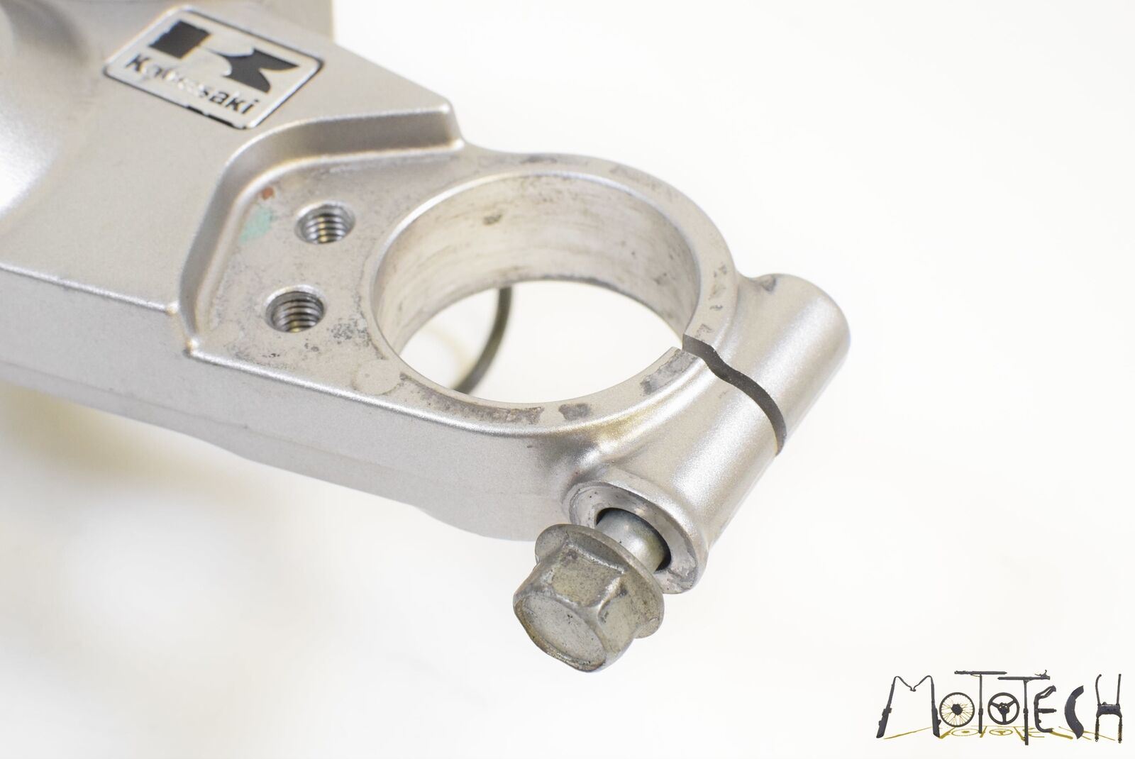 Used Kawasaki motorcycle upper triple clamp in silver, available at Mototech271
