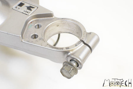 Used Kawasaki motorcycle upper triple clamp in silver, available at Mototech271