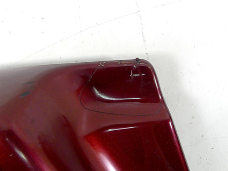 Used red motorcycle body panel with minor scratches and chipped corner, available at Mototech271