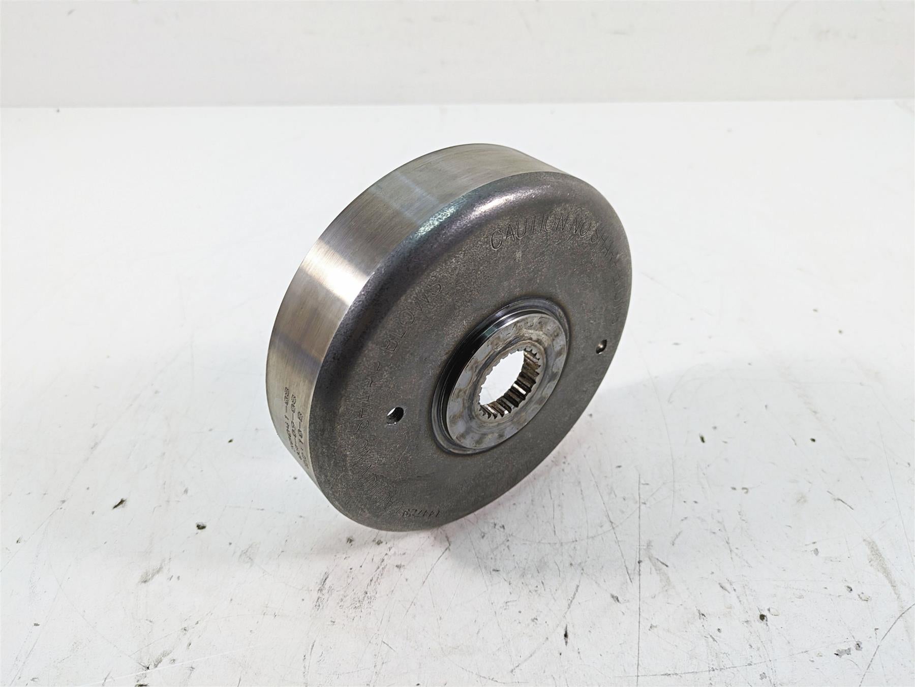 Used motorcycle flywheel part on white background, available at Mototech271