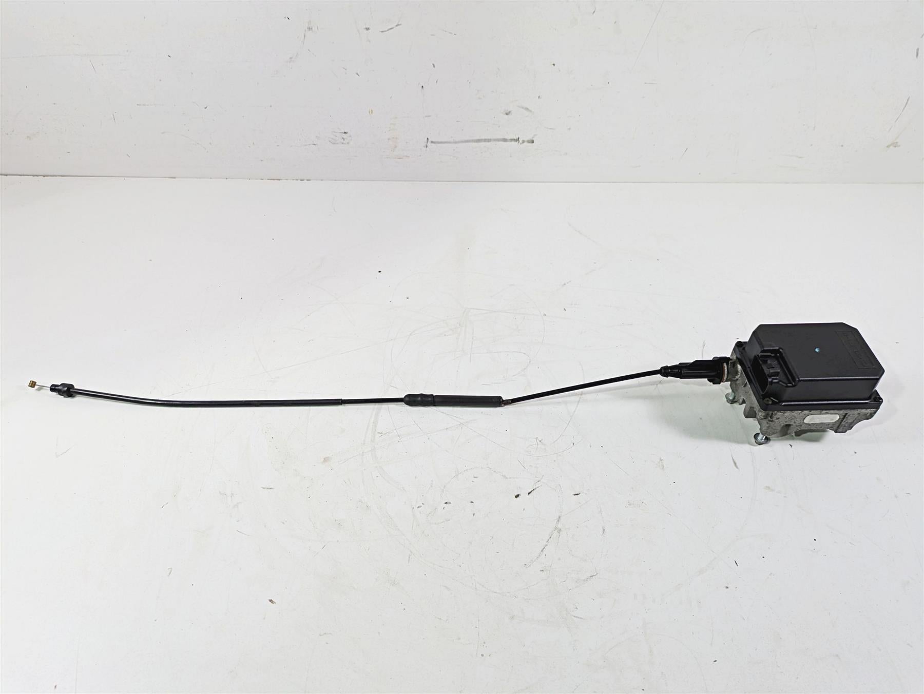 Used motorcycle control unit with attached cable on white background, available at Mototech271