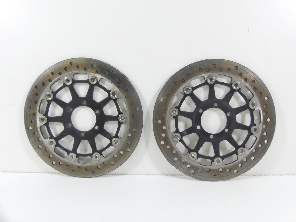 Pair of used motorcycle front brake rotors with drilled design on white background, available at Mototech271