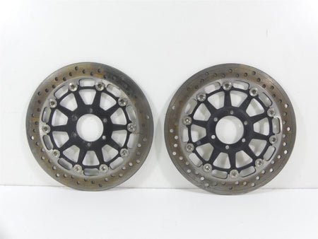 Pair of used motorcycle front brake rotors with drilled design on white background, available at Mototech271