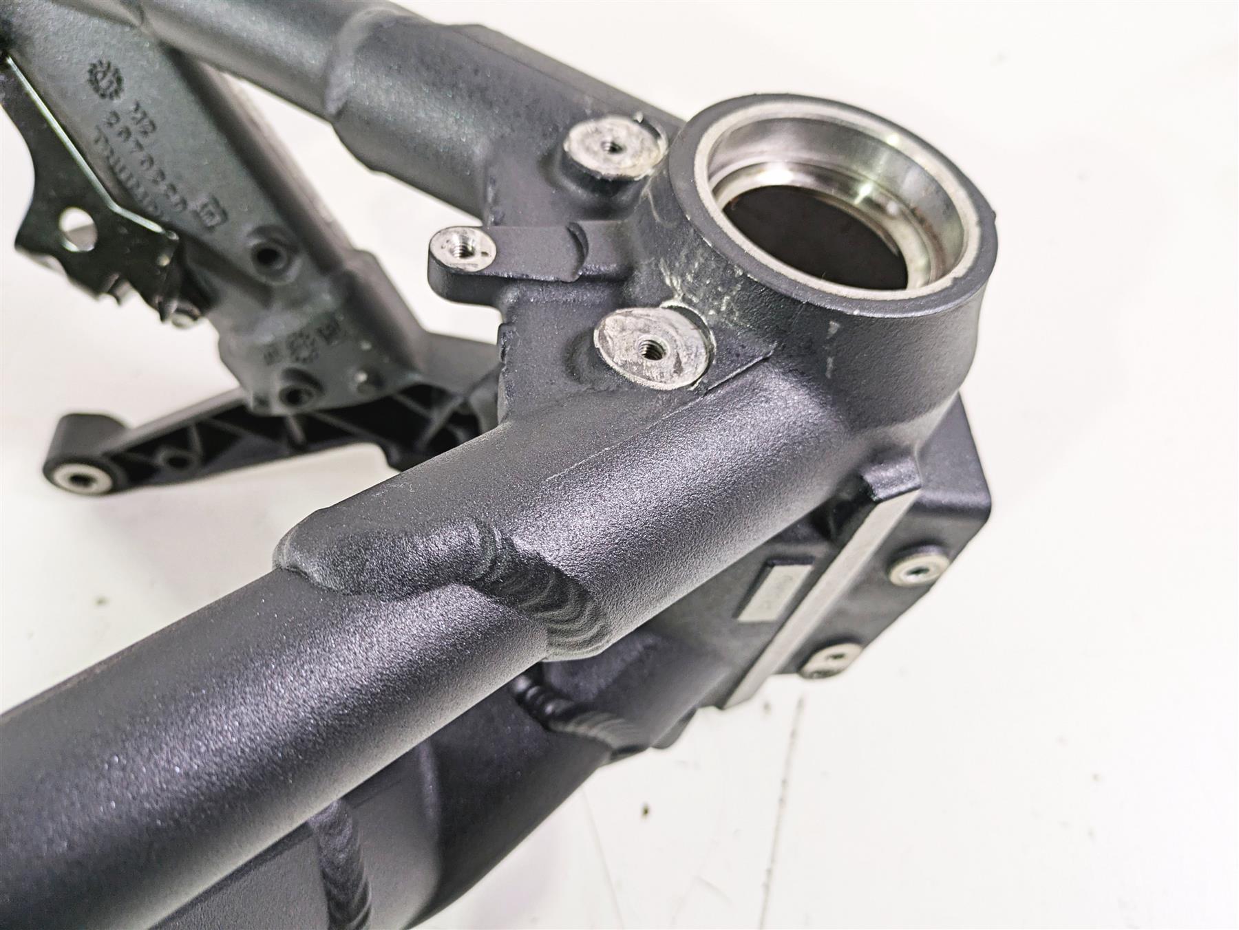 Used motorcycle frame head tube in black metal with welds and bolt mounts, available at Mototech271