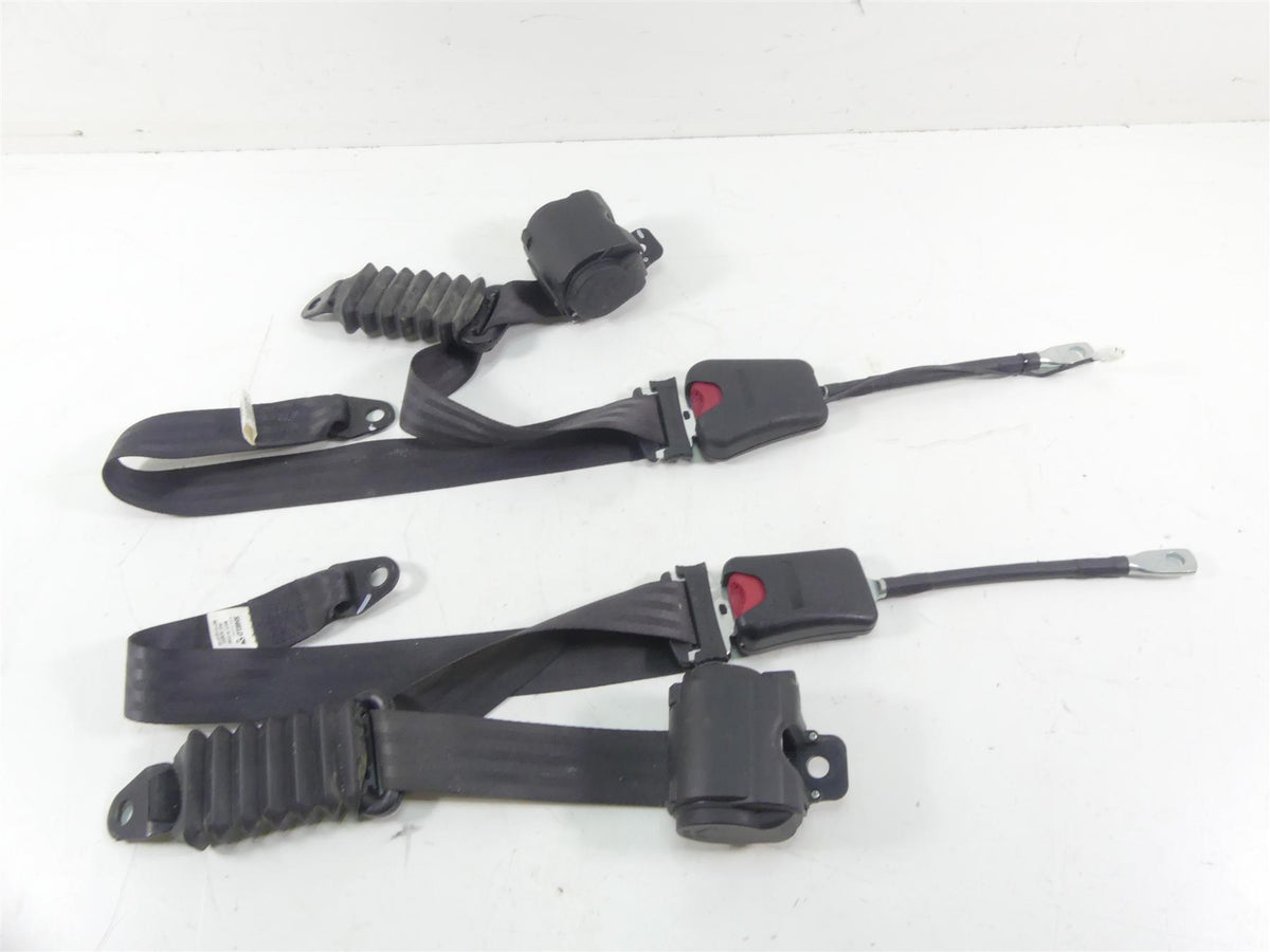 Used motorcycle seat belts with retractors and buckles on white background, available at Mototech271