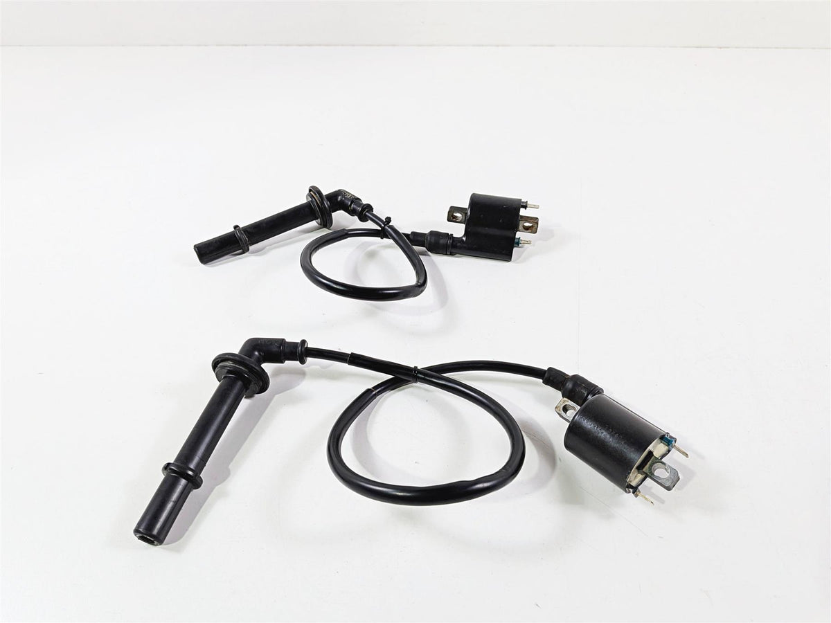 Used motorcycle ignition coils and spark plug wires on white background, available at Mototech271