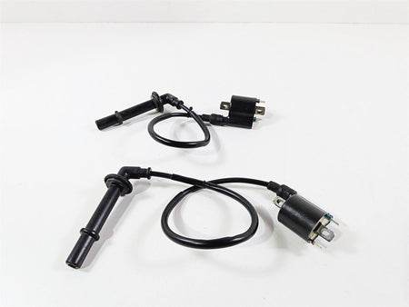 Used motorcycle ignition coils and spark plug wires on white background, available at Mototech271
