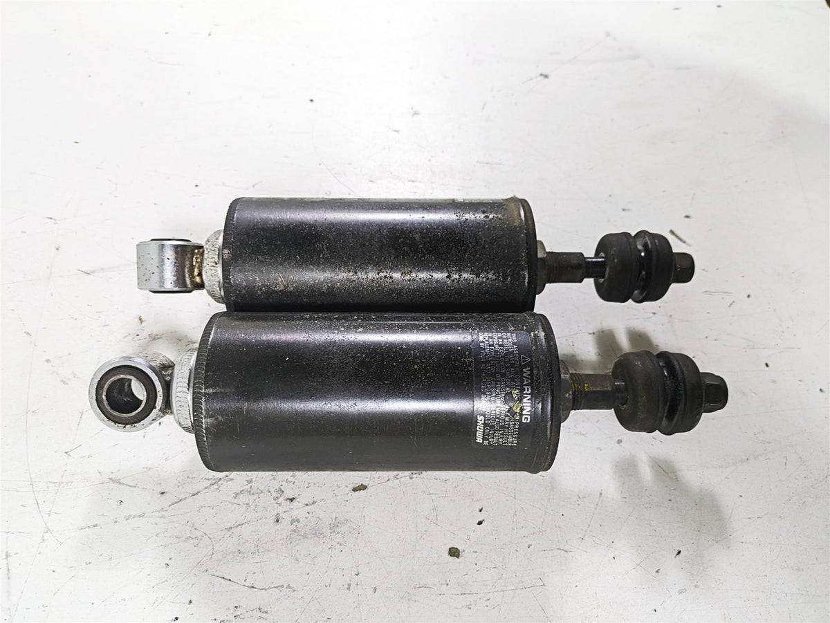 Used black motorcycle shock absorbers on white background, available at Mototech271
