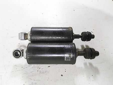 Used black motorcycle shock absorbers on white background, available at Mototech271