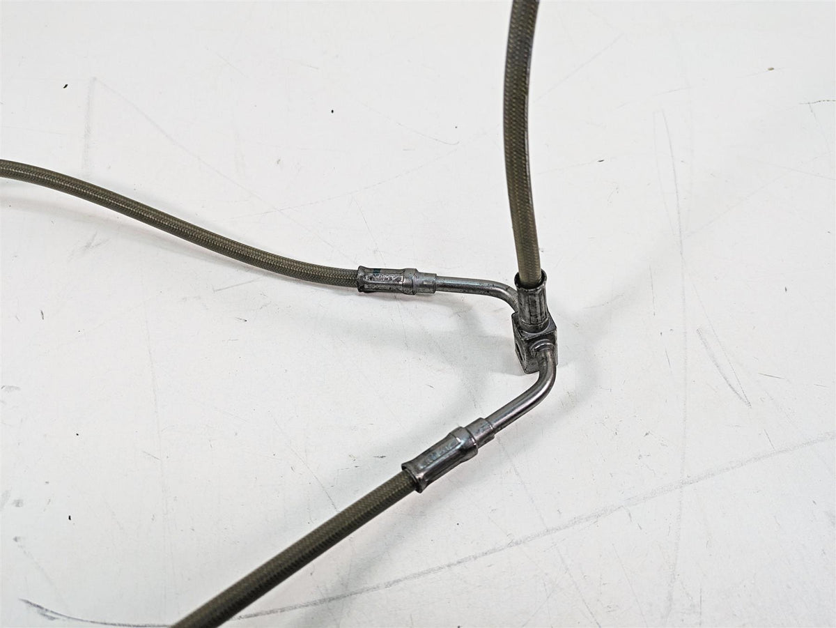 Used motorcycle braided brake line splitter with metal fittings on white background, available at Mototech271