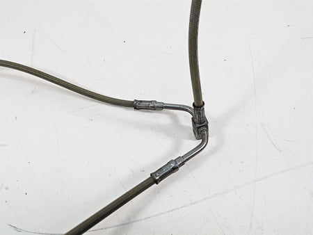 Used motorcycle braided brake line splitter with metal fittings on white background, available at Mototech271