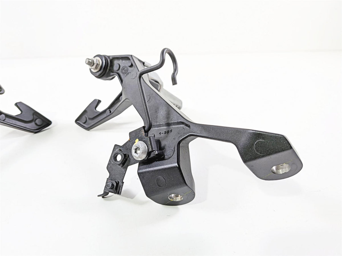 used motorcycle rearset footpeg bracket metal part on white background, available at Mototech271