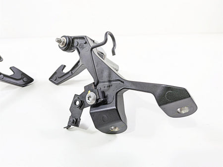 used motorcycle rearset footpeg bracket metal part on white background, available at Mototech271
