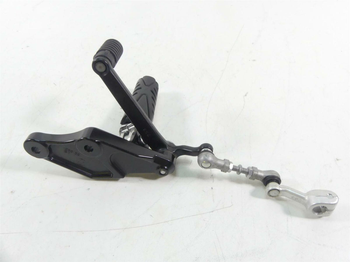 Used motorcycle gear shifter lever with linkage on white background, available at Mototech271