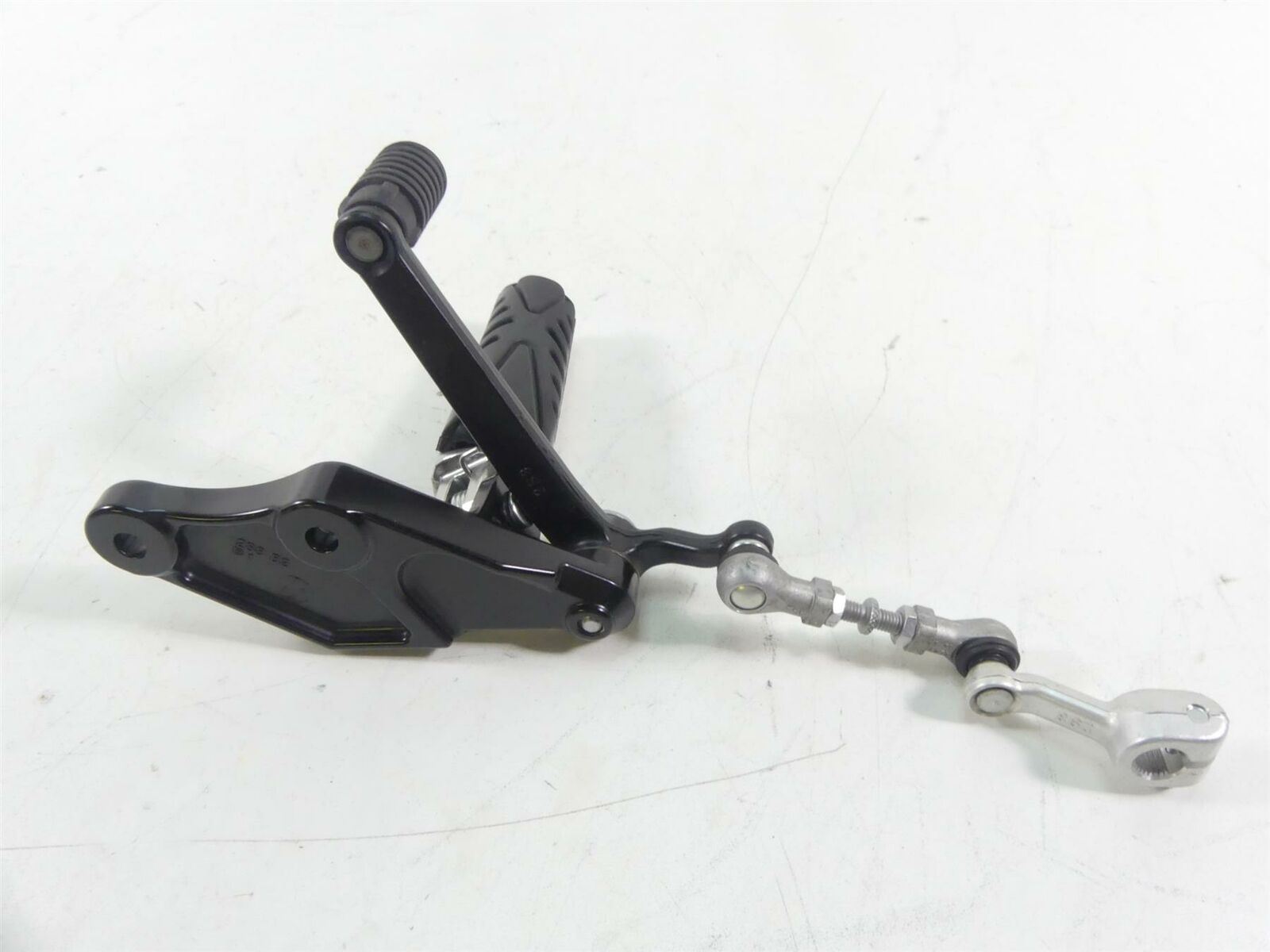 Used motorcycle gear shifter lever with linkage on white background, available at Mototech271