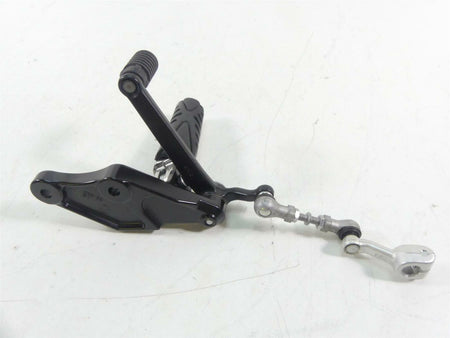 Used motorcycle gear shifter lever with linkage on white background, available at Mototech271
