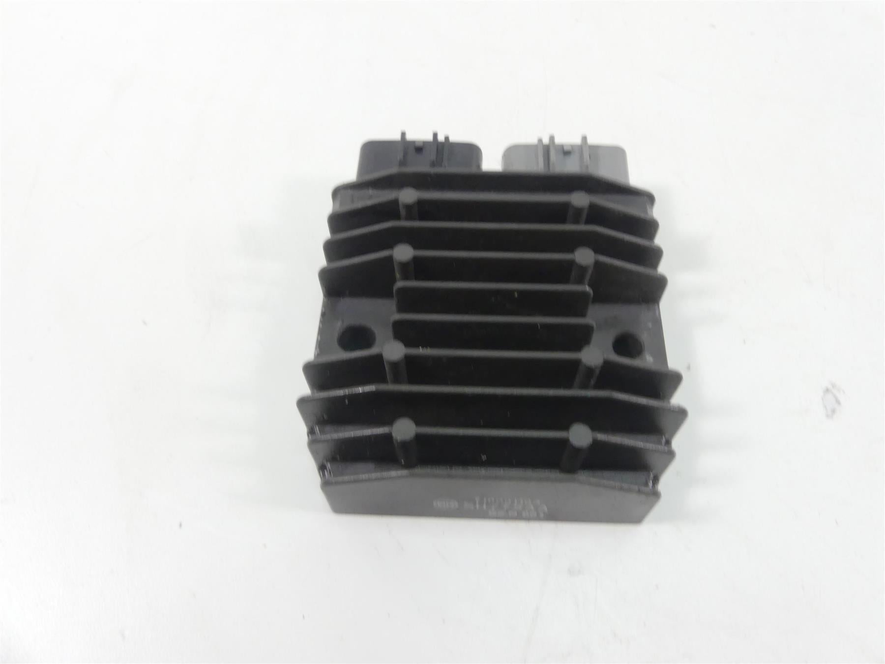 Used motorcycle regulator rectifier with cooling fins on white background, available at Mototech271