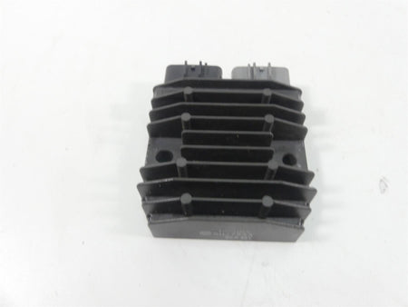 Used motorcycle regulator rectifier with cooling fins on white background, available at Mototech271