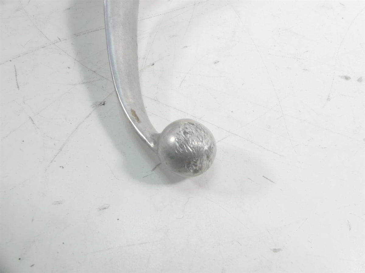 Used motorcycle brake or clutch lever tip with visible wear on white background, available at Mototech271