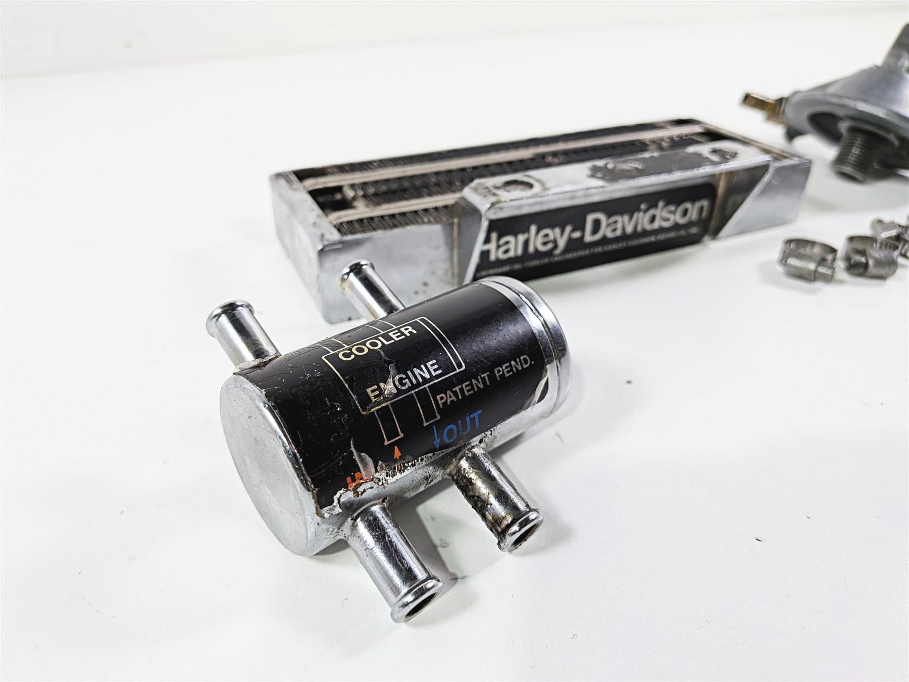 Used Harley-Davidson motorcycle engine oil cooler part with connectors, available at Mototech271