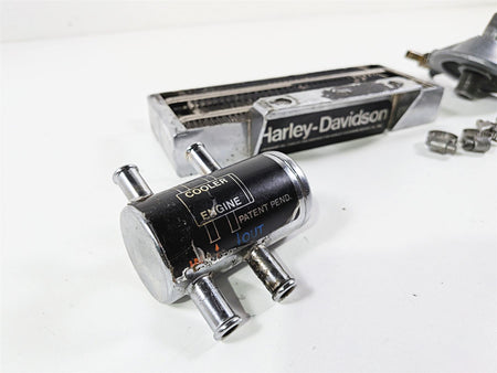 Used Harley-Davidson motorcycle engine oil cooler part with connectors, available at Mototech271