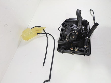 Used motorcycle radiator assembly with hoses and coolant reservoir, available at Mototech271