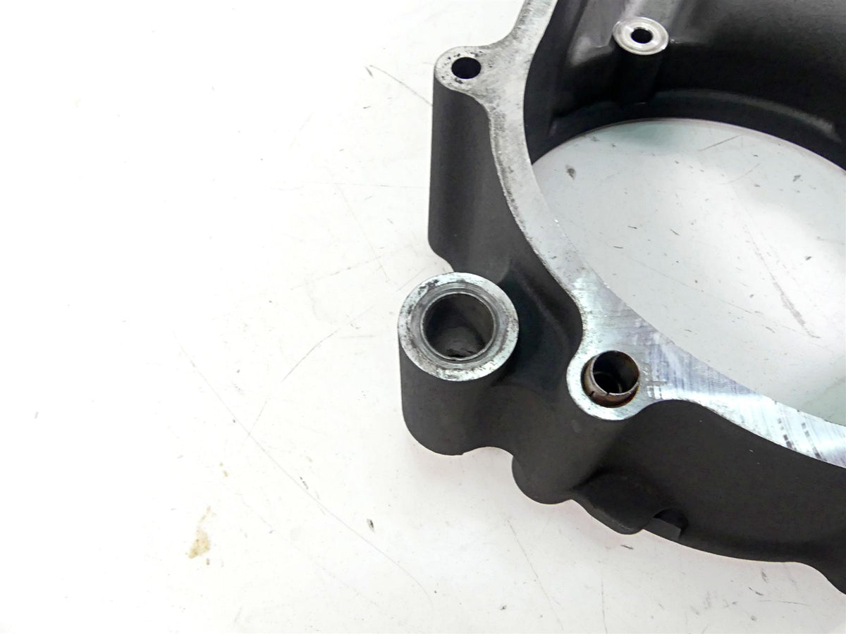 Used motorcycle engine cover part on white background, available at Mototech271