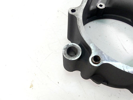 Used motorcycle engine cover part on white background, available at Mototech271