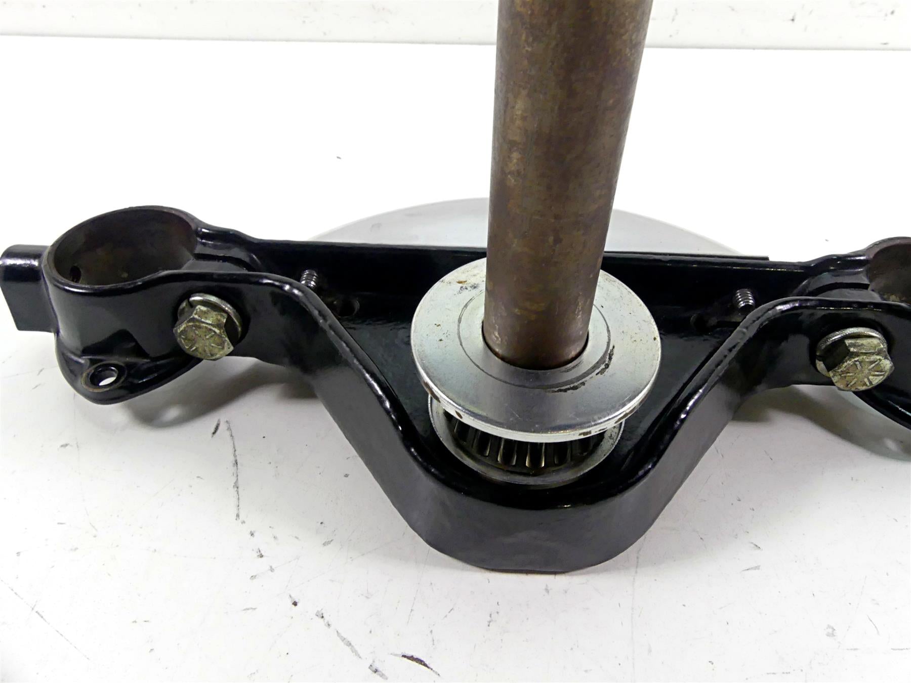 Used motorcycle triple tree clamp with bearings and bolts, available at Mototech271