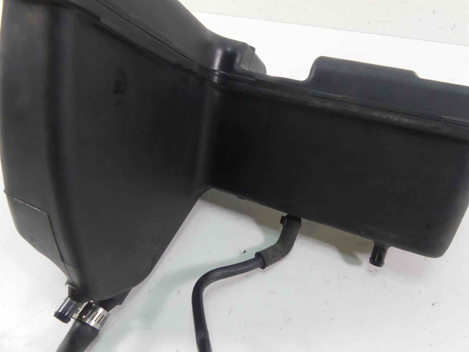 Used motorcycle airbox intake with attached hoses on white background, available at Mototech271