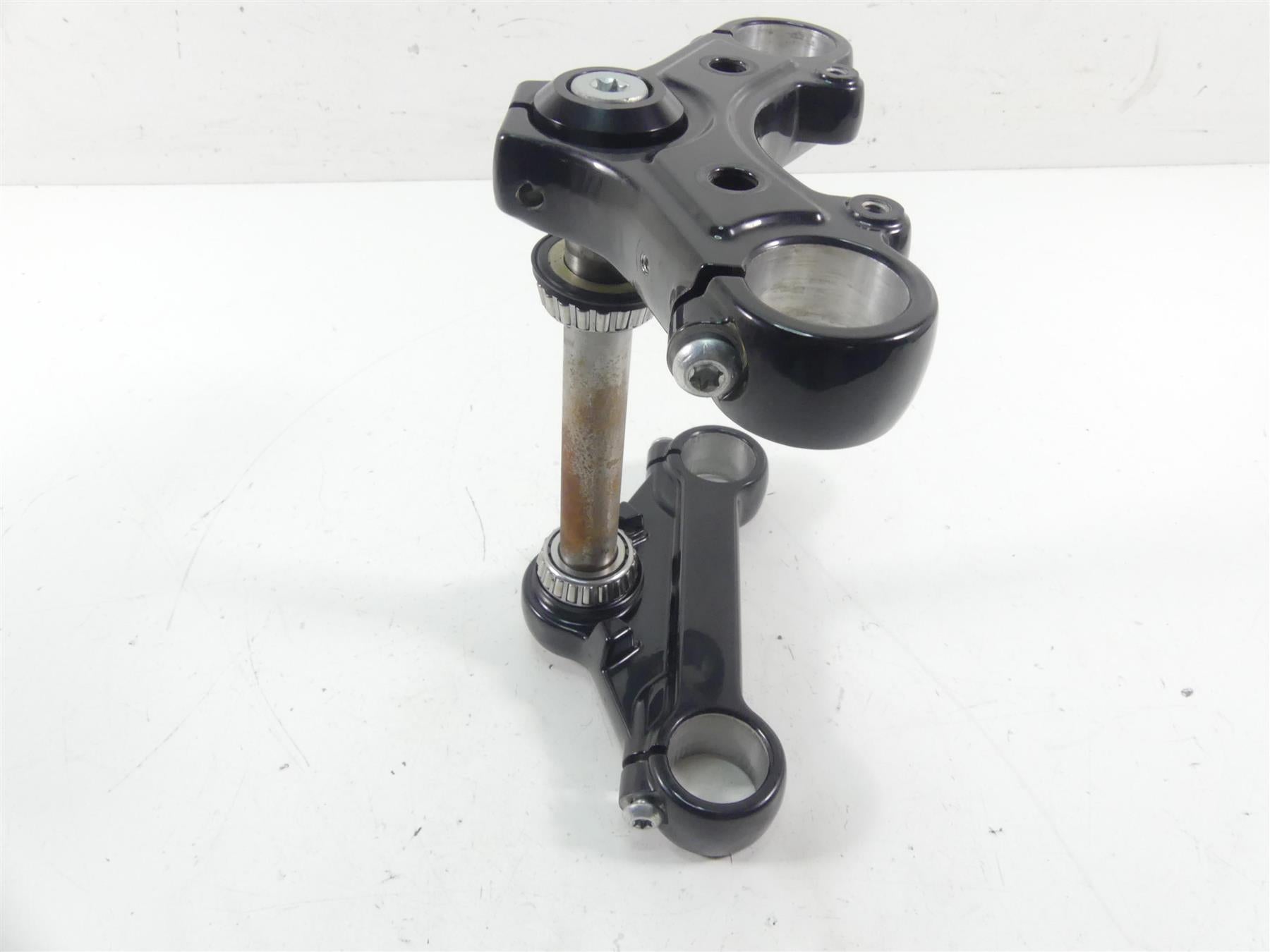 Used motorcycle triple tree fork clamp assembly on white background, available at Mototech271
