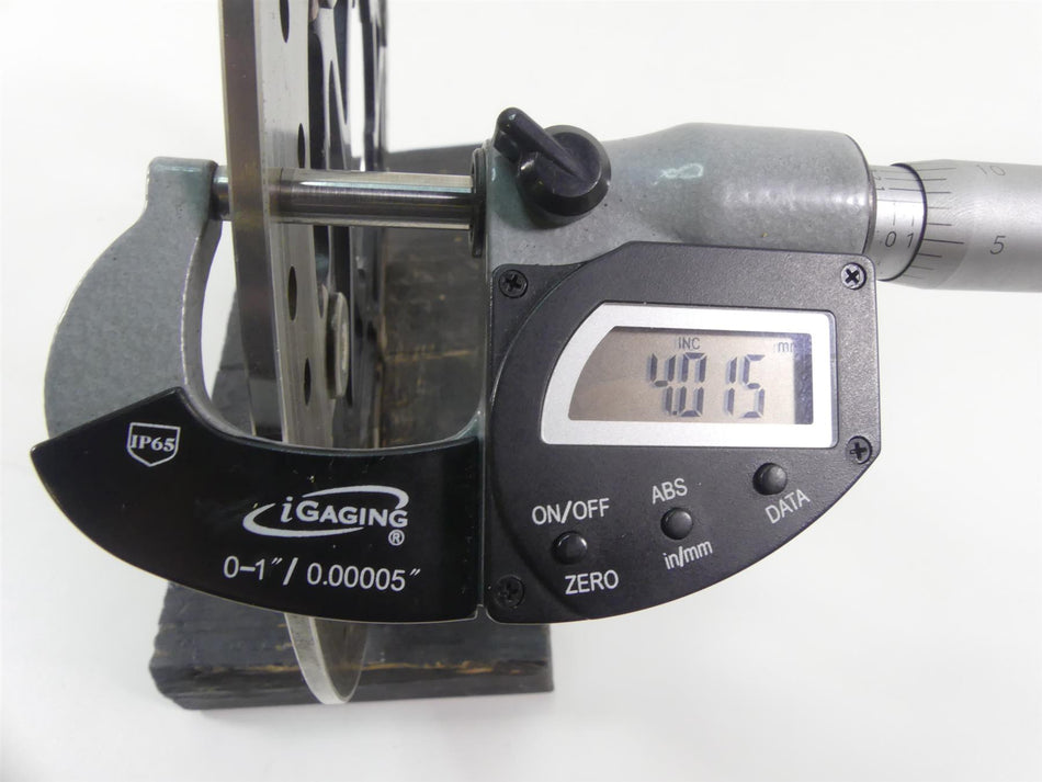 Digital micrometer measuring motorcycle brake rotor thickness, 4.015 mm, available at Mototech271