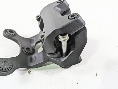Used black motorcycle brake caliper with mounting bracket on white background, available at Mototech271