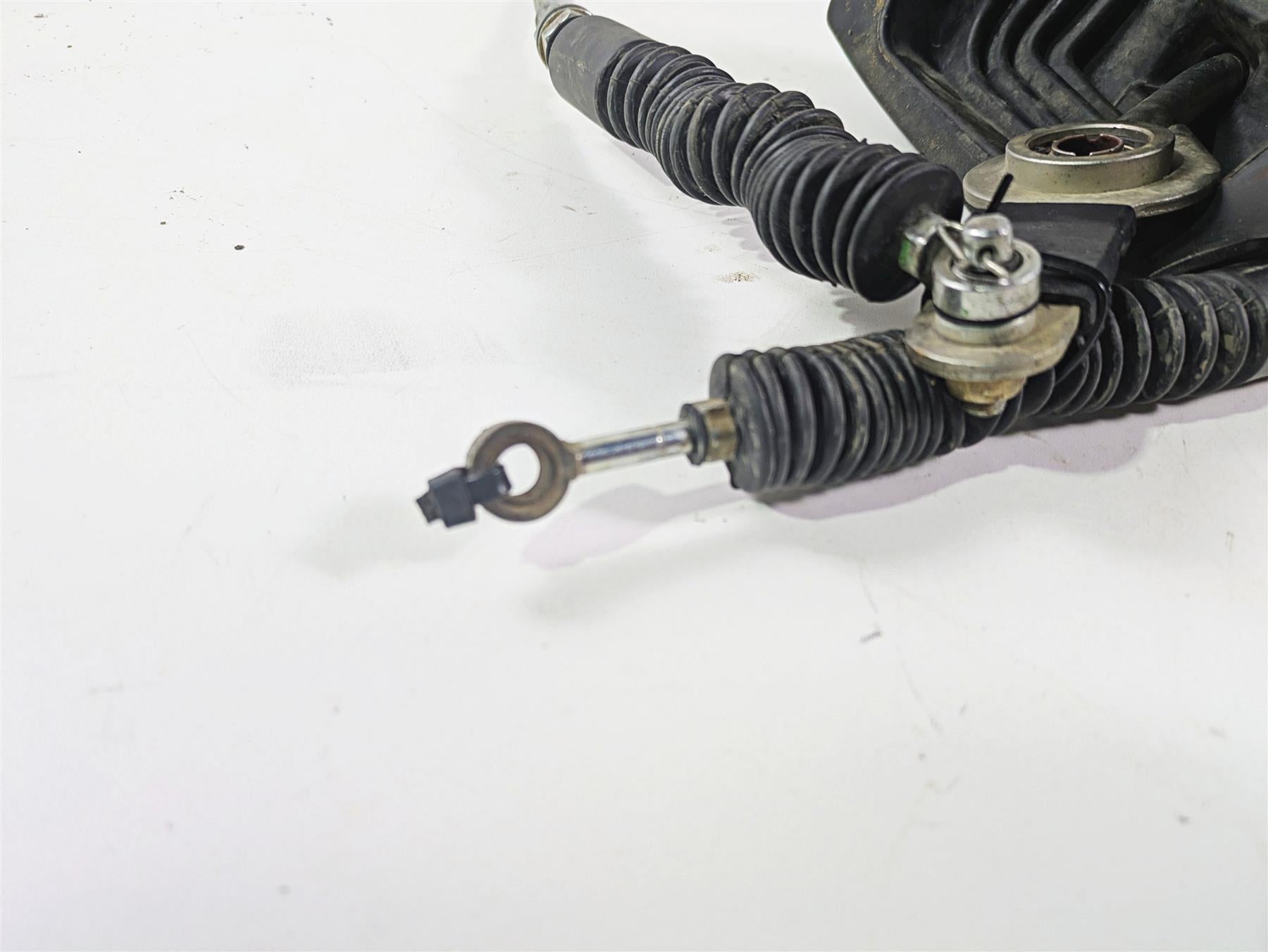 Used motorcycle throttle cable and boot on white background, available at Mototech271